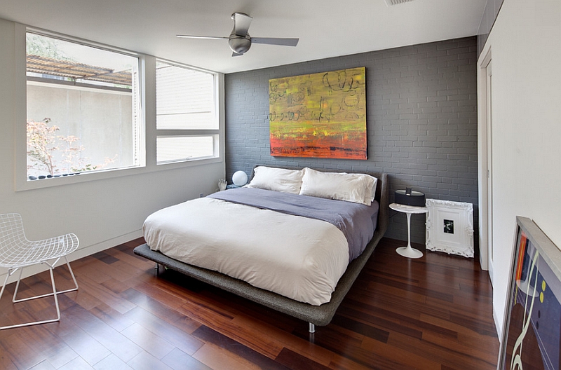 Grey accent wall brings sophistication to the bedroom