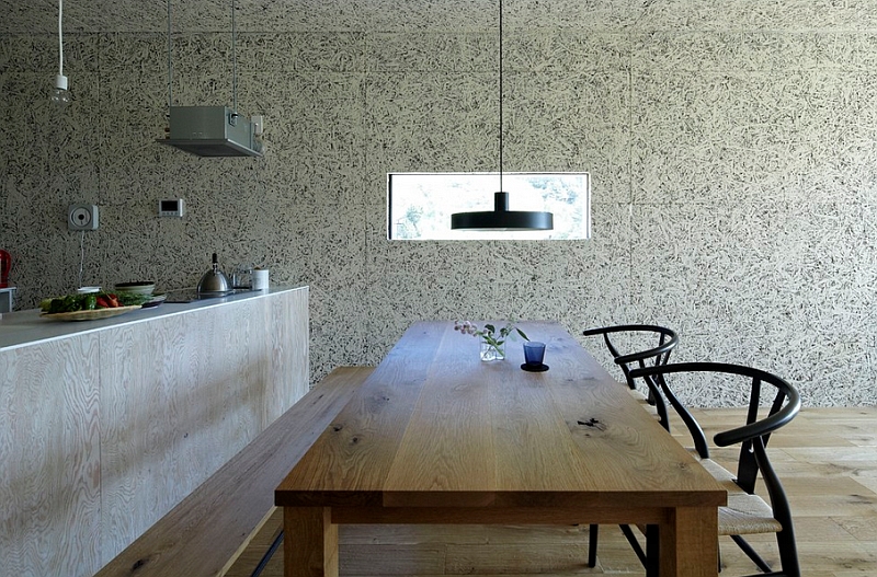 Japanese style dining room with a simple wooden table and Wishbone chairs