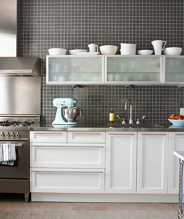 Kitchen with stainless steel countertops and a black grid backsplash