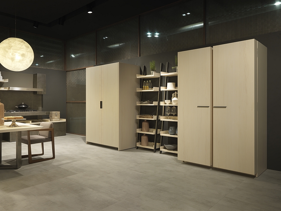 Ladder style shelves placed between the large kitchen cabinets