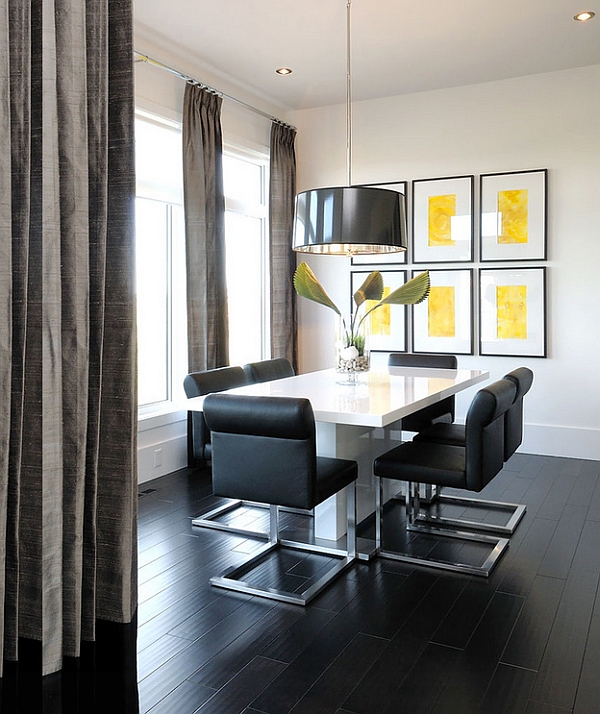 Large black pendant turns the dining space into an instant focal point