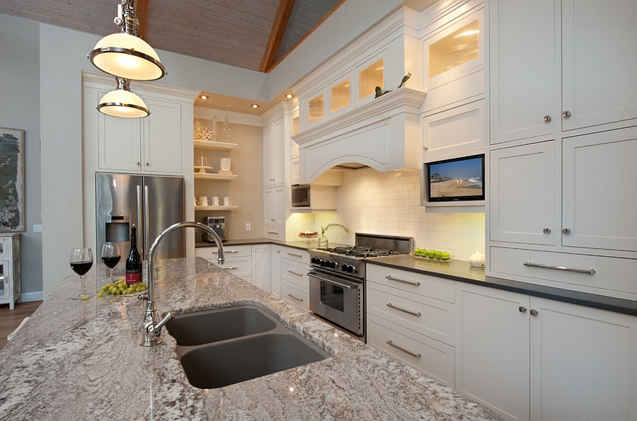 Large kitchen island with granite countertop and two sinks