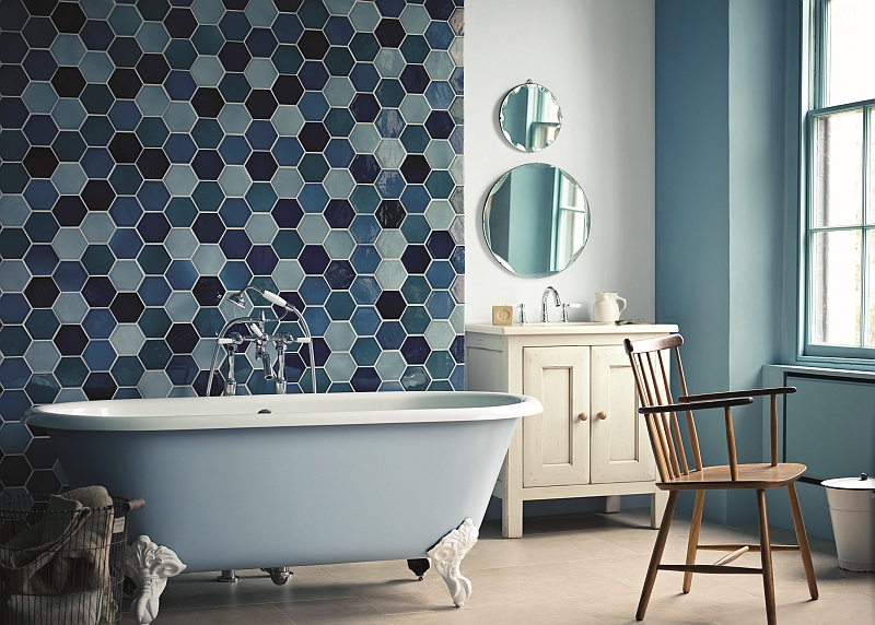 Luxurious bathroom with a claw-foot standalone tub in gentle blue