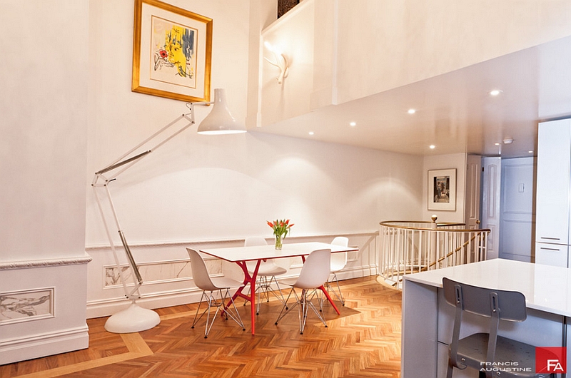 Modern dining space with an oversized floor lamp in white