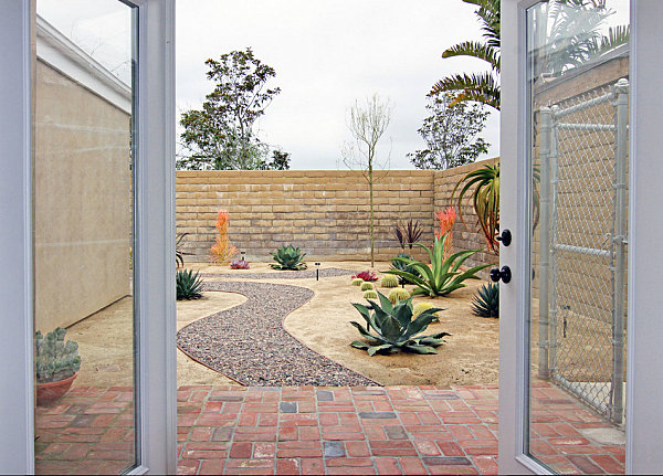 Modern xeriscaped yard with colorful plants