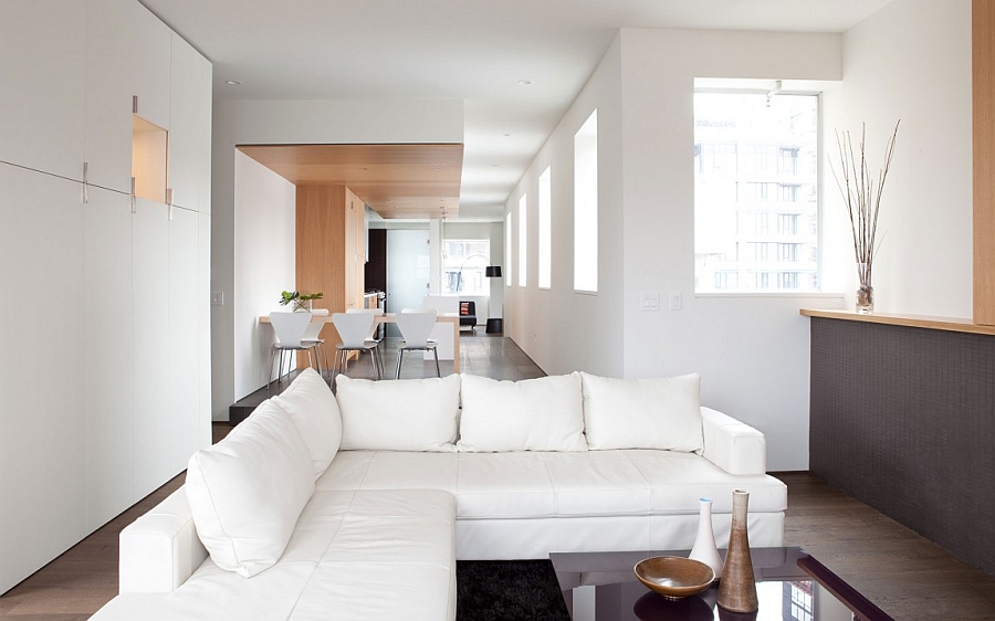 Open floor living plan and plush sofa in white