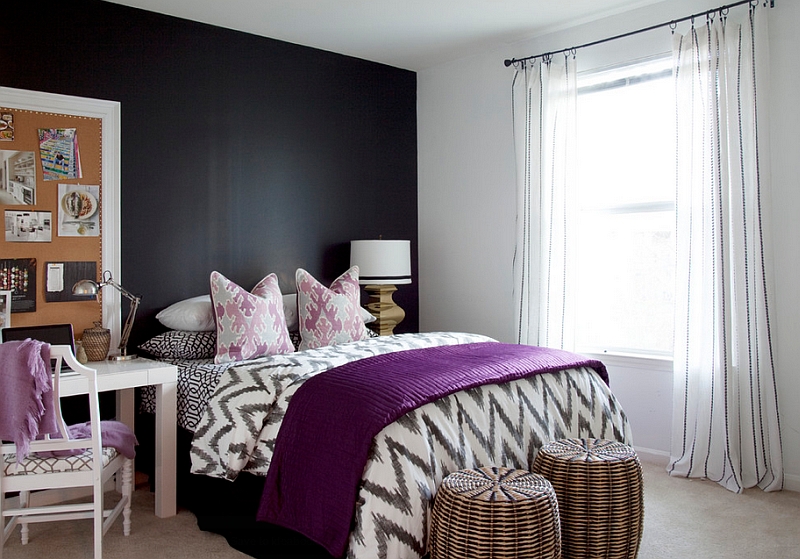 Plush purple accents in the black and white bedroom