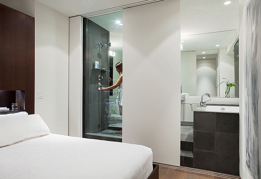 Sliding panel offers privacy for the glass bath