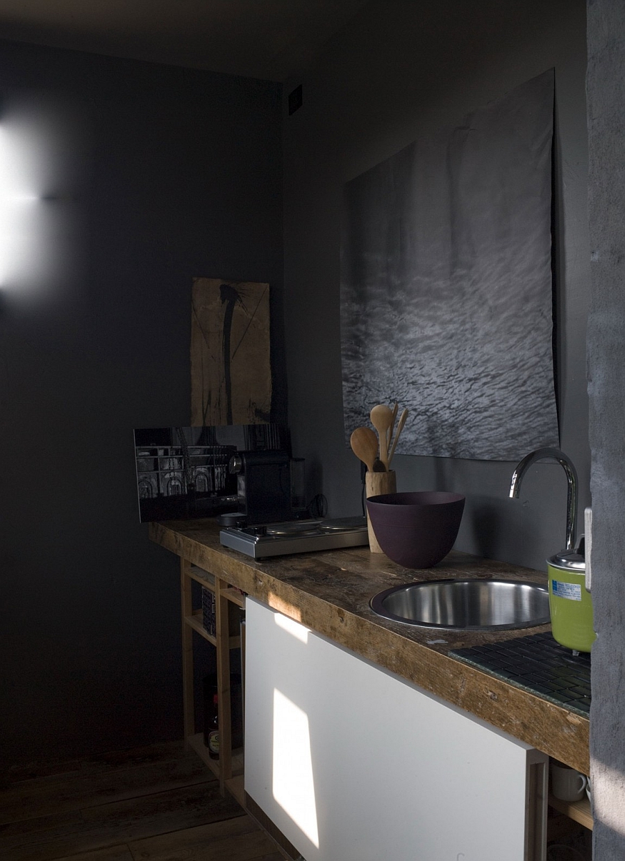 Small kitchen area that is rustic