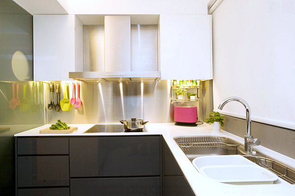 Stainless steel backsplash in a kitchen with colorful accents