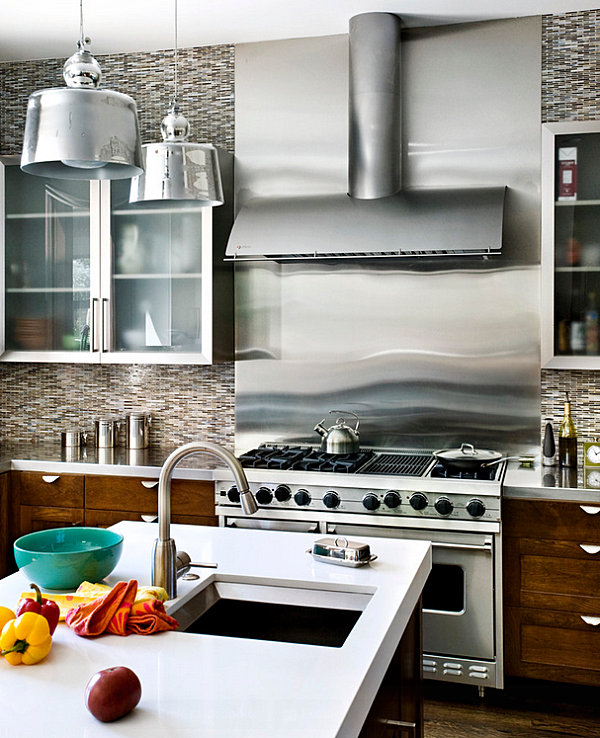 Stainless steel backsplash near the stove in a bright kitchen