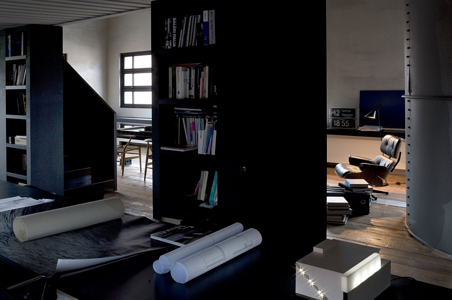 Tall shelves and the Eames Lounger grace the interior