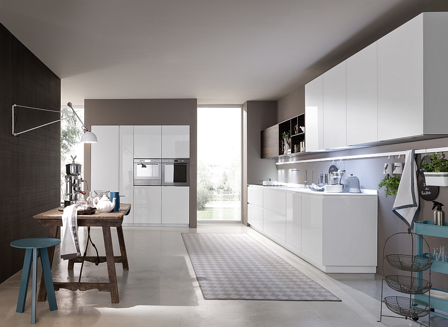 White glossy lacquered base units and Corian glacier white worktop in the kitchen