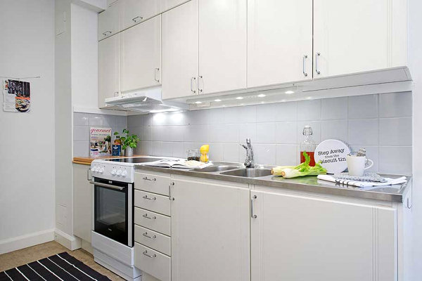 White kitchen with stainless steel countertops