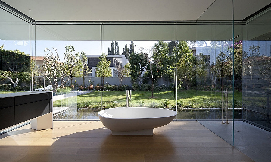 White standalone tub in the expansive contemporary bathroom