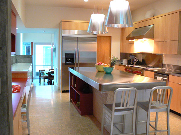 Wooden cabinetry and stainless steel countertops in a modern kitchen