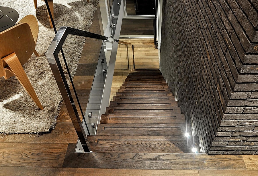 Wooden staircase with a glass railing