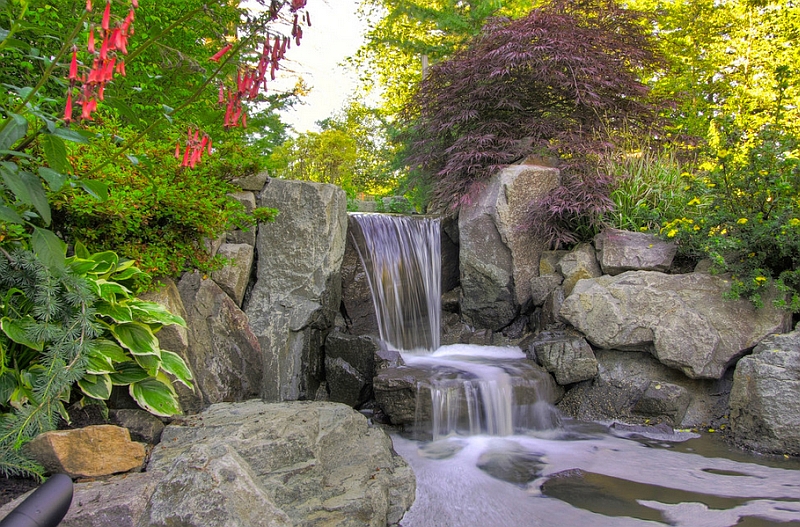 A natural water feature and a pond to create a stunning and soothing landscape