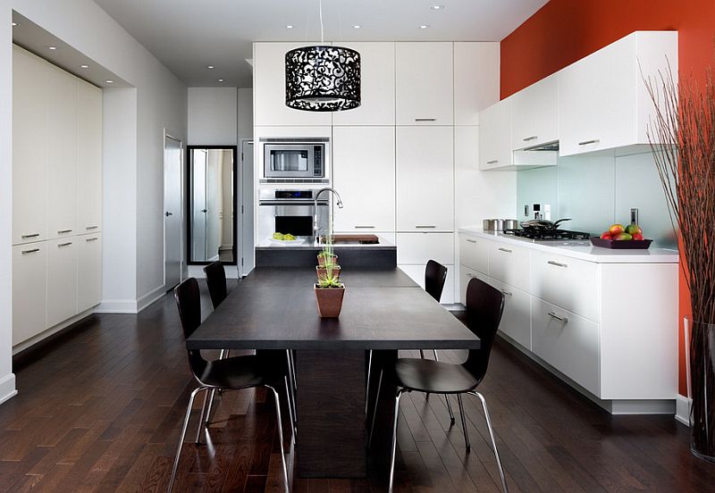 A pop of orange in the black and white kitchen