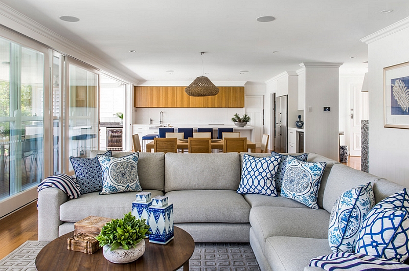 Accent pillows and ceramics are a classic way to bring the blue and white color scheme to the living room