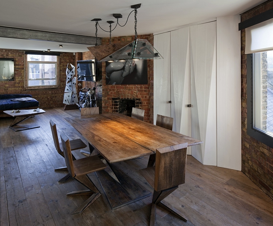 Beautiful and industrial lighting adds to the appeal of the brick wall apartment