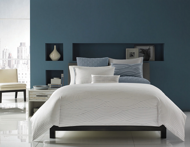 Blue with a hint of grey along with white give the bedroom a sophisticated look