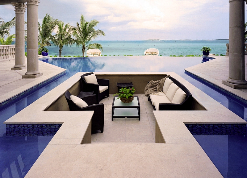 Breathtaking conversation pit surrounded by the pool with smartly hidden stepping stones