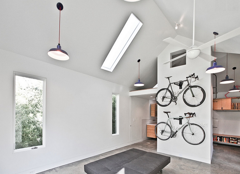 Contemporary bedroom with a minimal theme and a wall-mounted bike rack