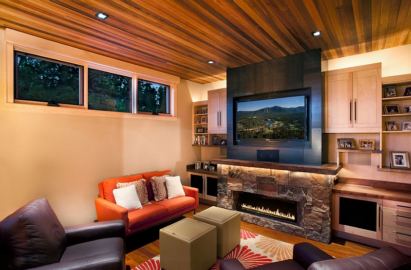 Contemporary family room makes best possible use of space with TV above the fireplace