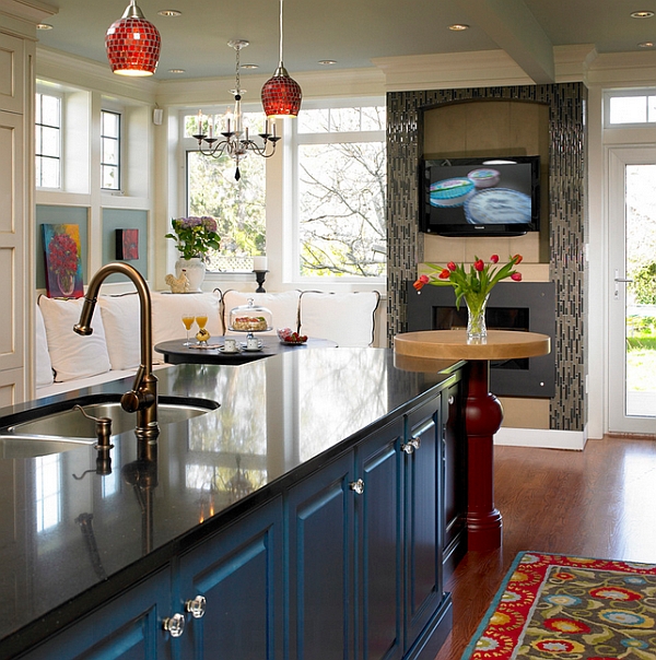 Contemporary kitchen with a TV above the fireplace!