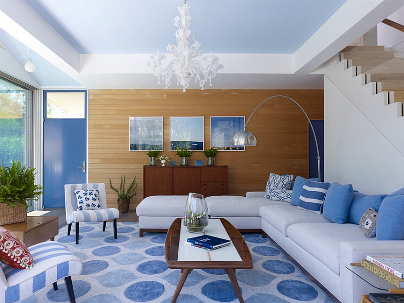 Contemporary living room in blue and white with a wooden accent wall