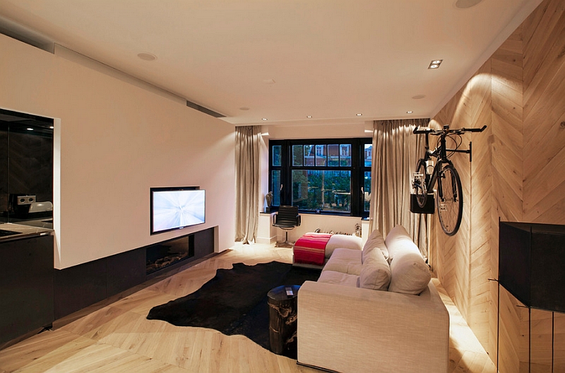 Contemporary living room with limited space and a wall mounted bicycle