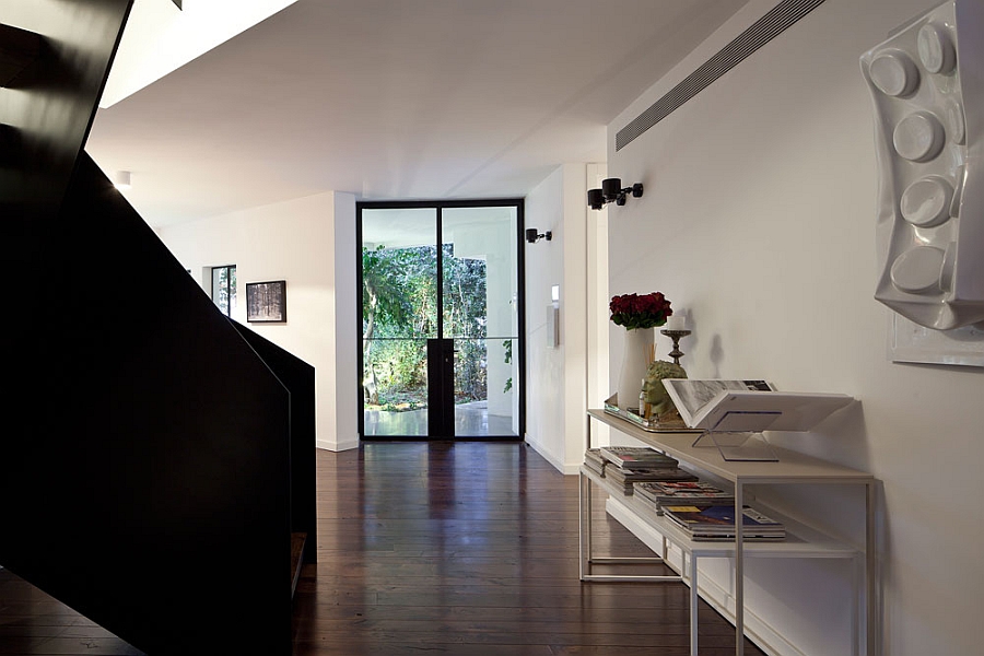 Contemporary staircase in black offers cool visual contrast