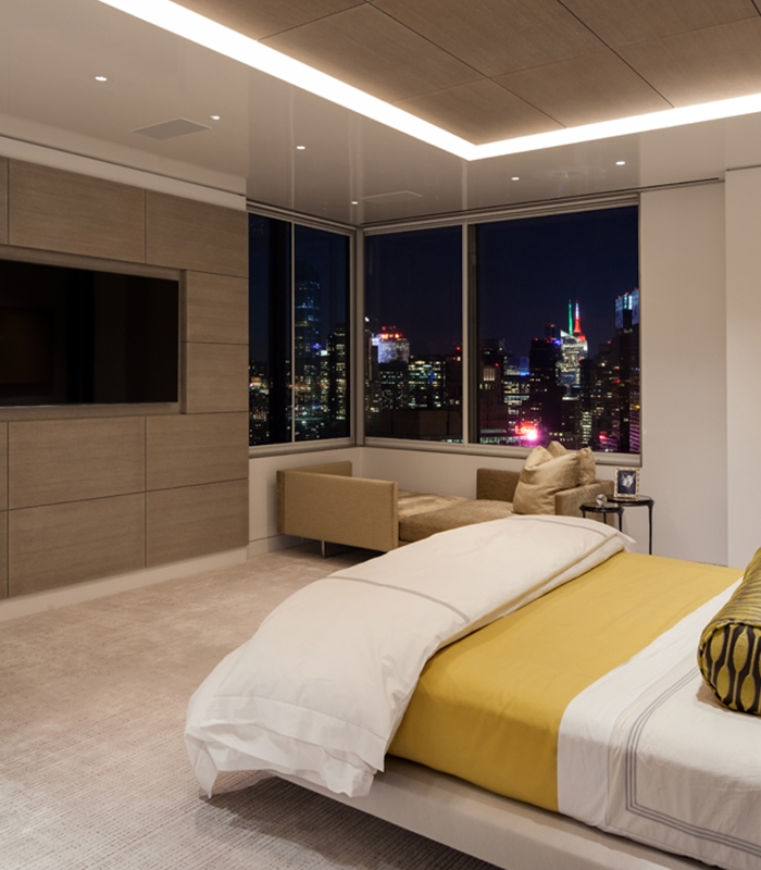 Cool yellow lighting takes over the bedroom at night