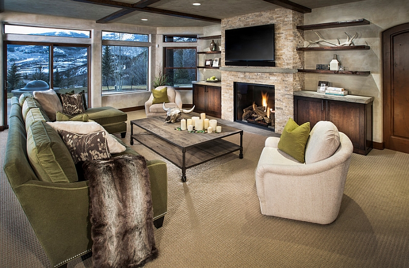 Cozy family room with floating shelves and a TV above the fireplace