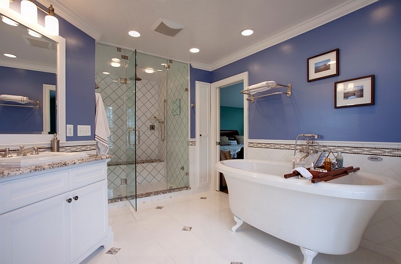 Darker shades of blue along with white give the bathroom a playful look