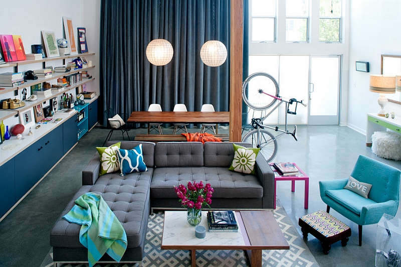 Eclectic living room with bright pops of color and a innovative bike display!