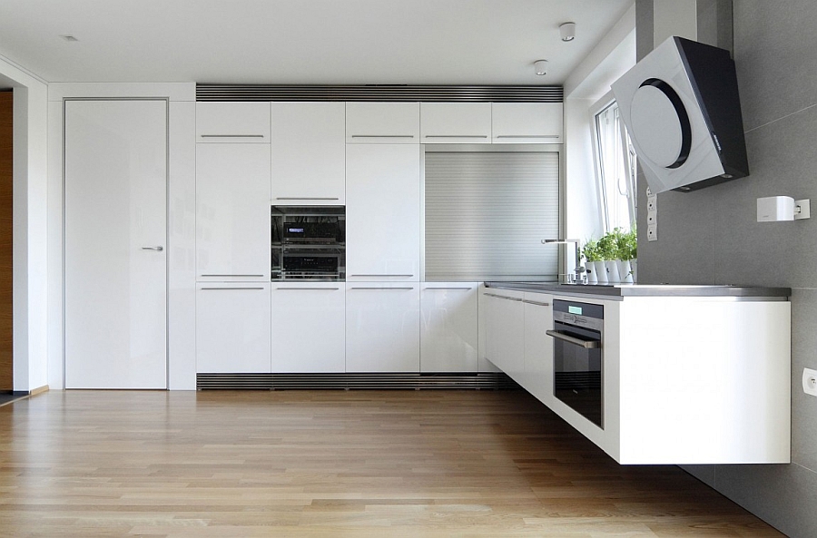 Ergonomic modern kitchen in white with floating shelves and counter