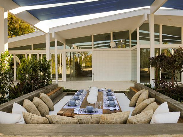 Fabric strips shade a sunken dining room