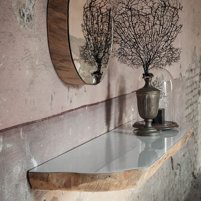 Floating tree trunk shelf with a mirrored finish