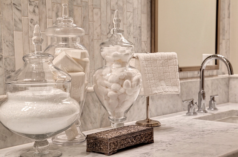 Glass apothecary jars help bring in a spal-like elegance to the bath