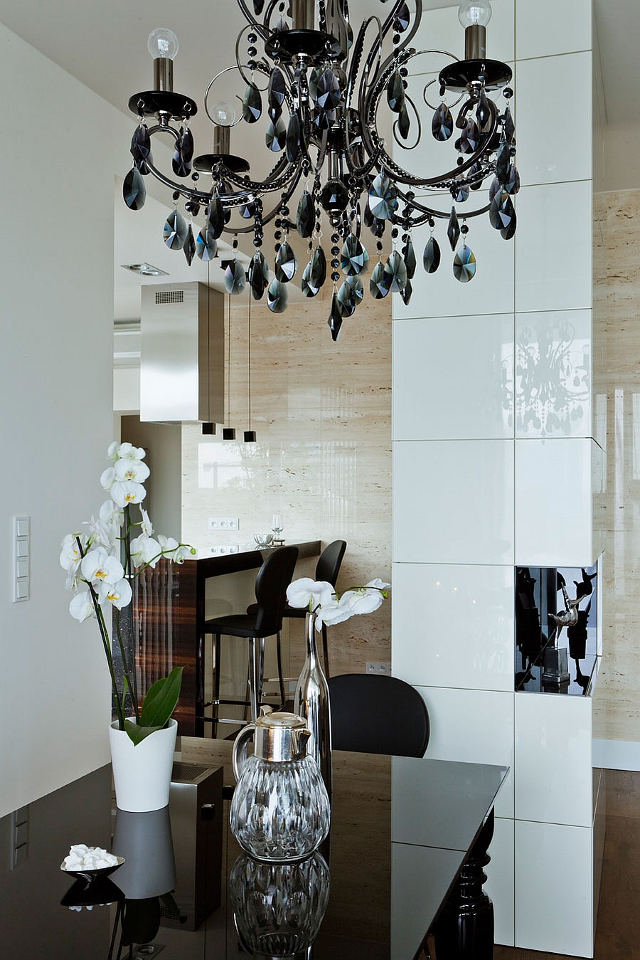 Gorgeous chandelier in black steals the show inside the sophisticated space