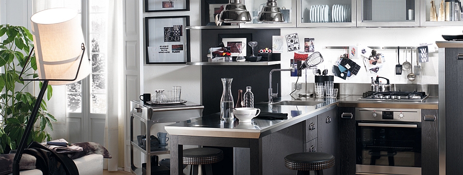 Kitchen with sparkling steel countertop, smart cart and glass door cabinets