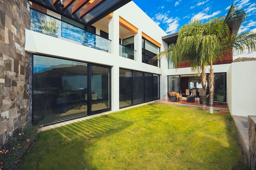 Large sliding glass doors leading to the private courtyard