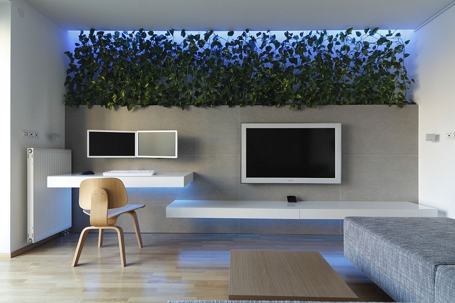 Living room with colorful LED lighting and a living wall