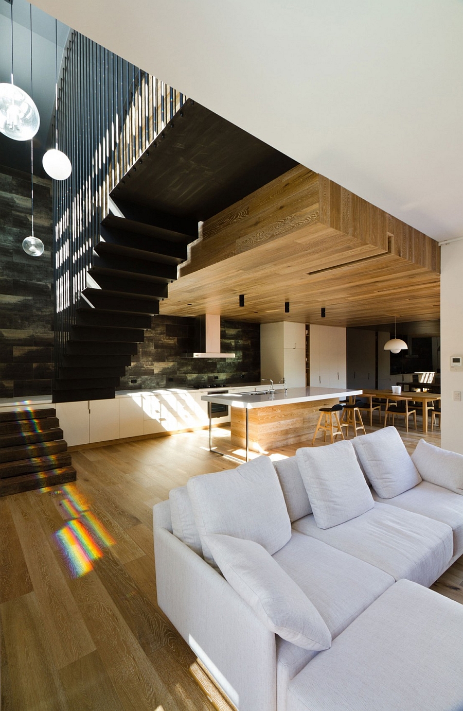 Modern interior with a high ceiling and warm wooden surfaces