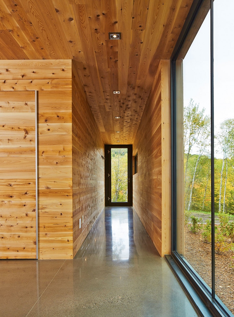 Narrow entry draped in wood panels