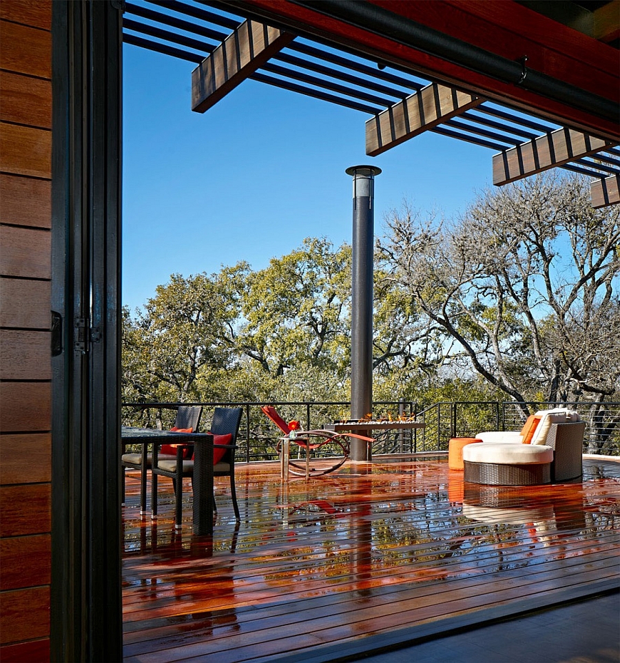 Outdoor deck space with a sleek fireplace