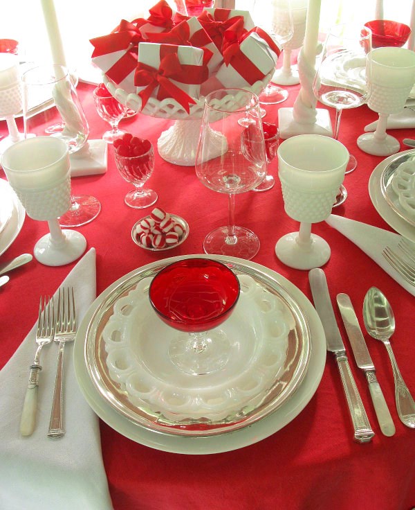 Pepperming and milk glass on a red tablecloth