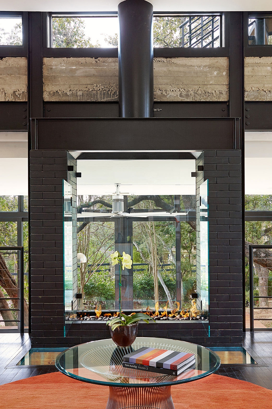 Platner coffee table in front of the fireplace